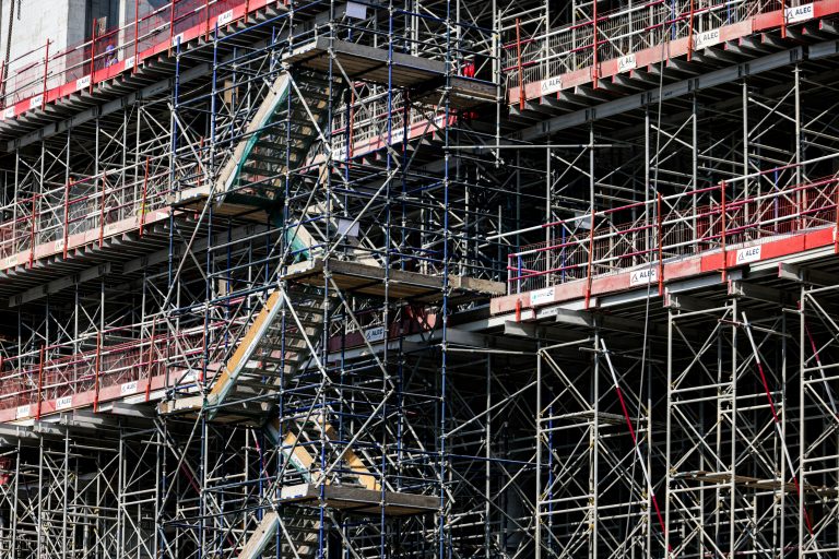 Steel scaffolding wrapped around a building under construction