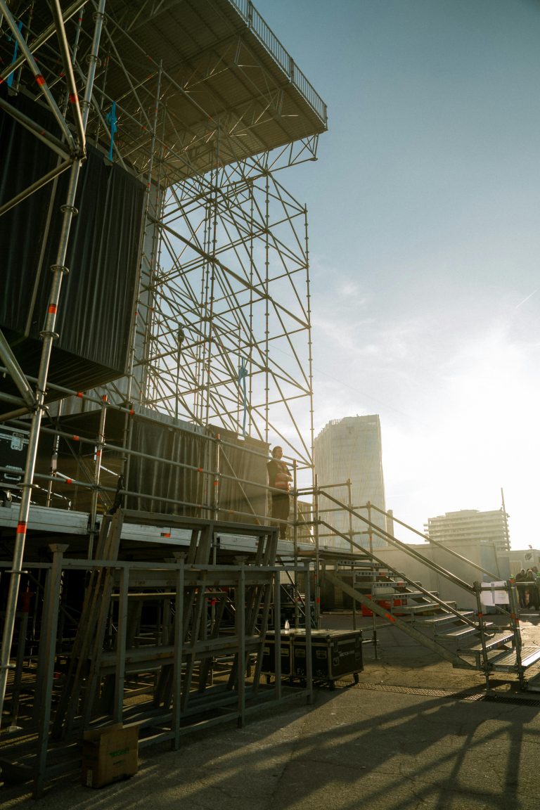 Scaffolding tower and access stairs on an outdoor construction site